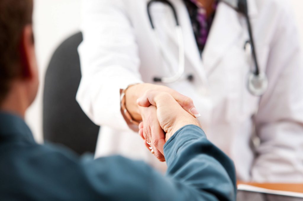 patient shaking doctors hand