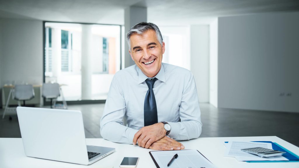 professional recruiter sitting at table with laptop